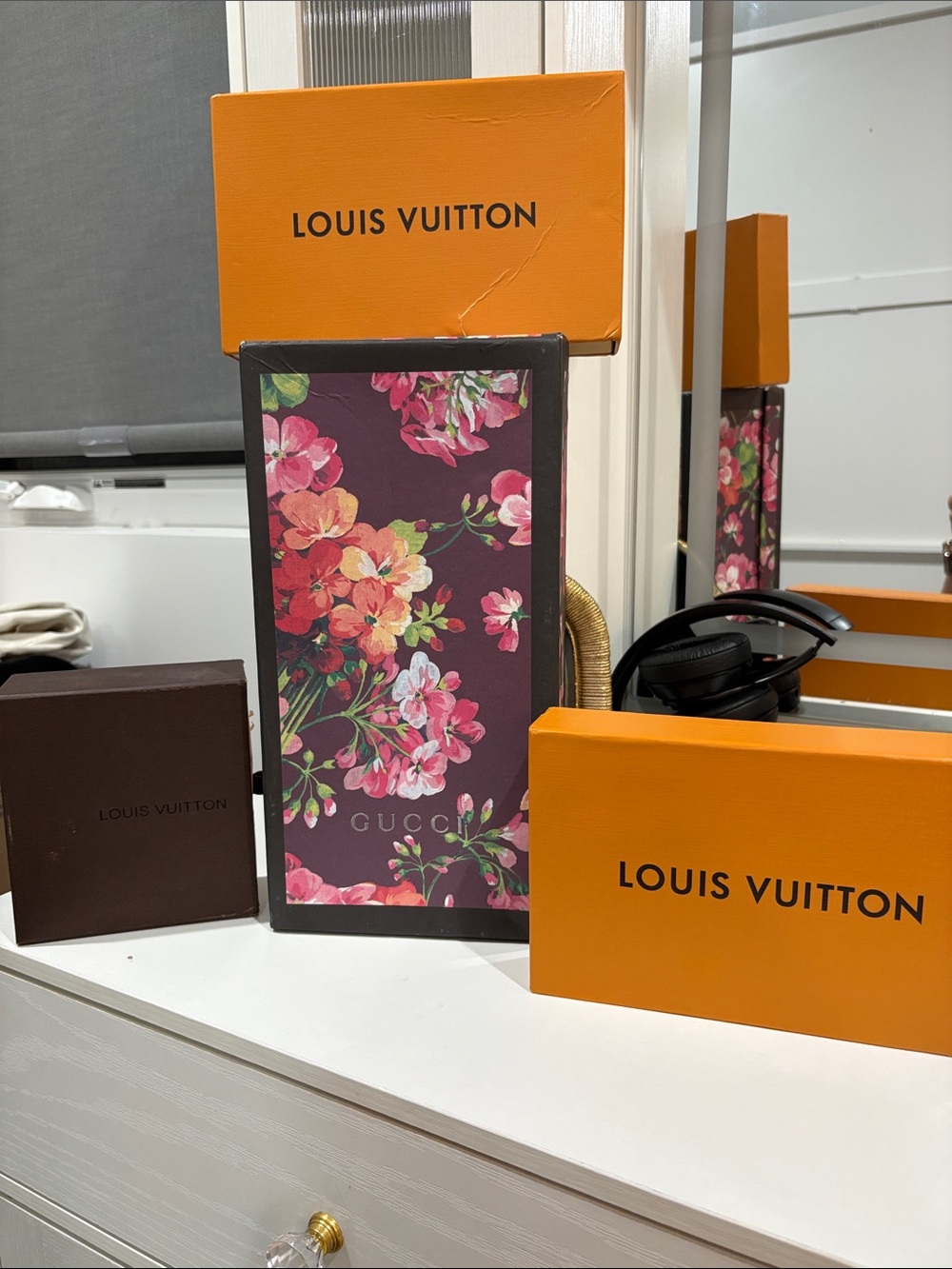 Old designer boxes used for shelf decoration